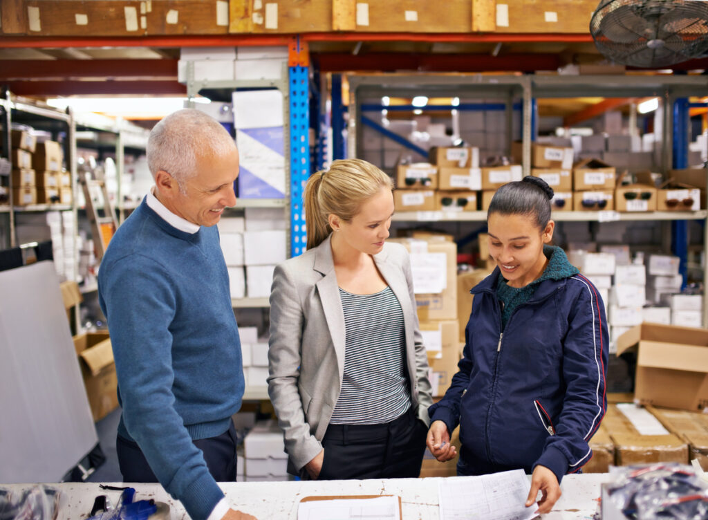 Shot of managers at work supervising a shipping and distribution business