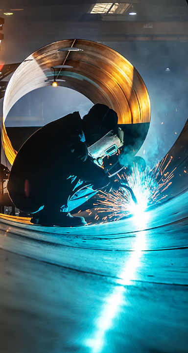 The welder is welding steel plates