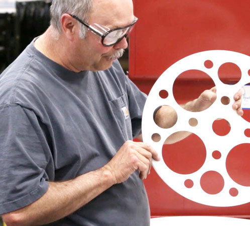 reelex floor worker inspecting wheel