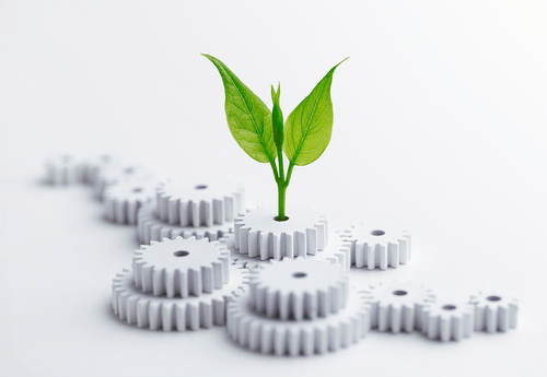 earth day plant emerging from gears