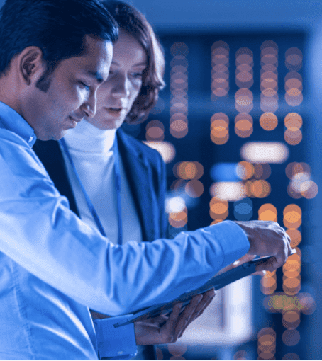 server room employees on tablet